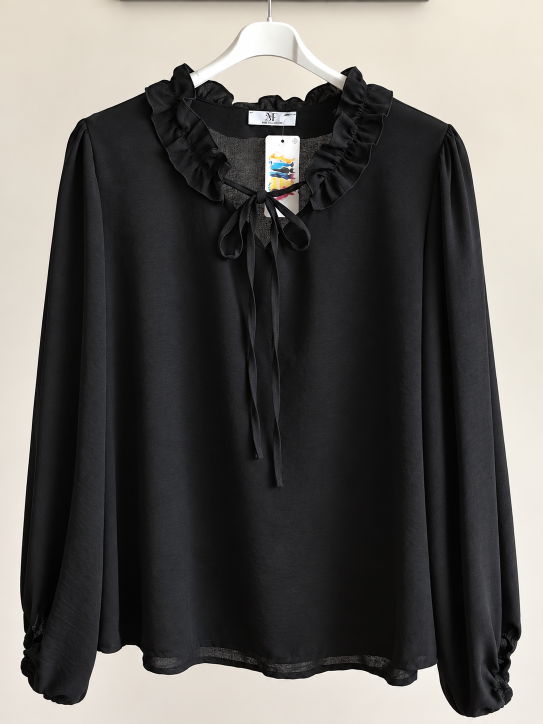 Blusa romantica con fiocchetto